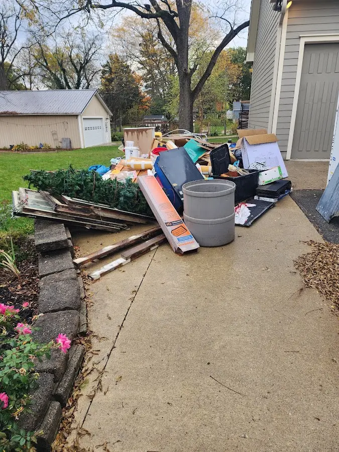 Dumpster being loaded with debris for 30 Yard Dumpster Rental in West Hartford